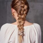 Woman with a protective braid hairstyle.